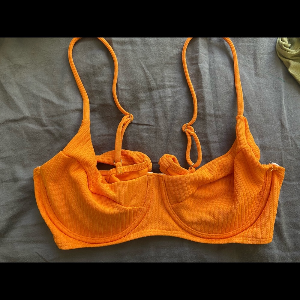 Swimsuit top, vibrant orange, never used, new, adjustable straps.